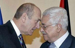 Israel's Prime Minister Ehud Olmert (L) speaks with Palestinian President Mahmoud Abbas during their meeting in Jerusalem Jan. 8, 2008. (Xinhua/Reuters Photo)