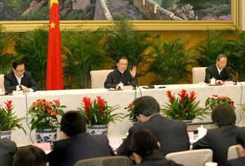 Chinese Premier Wen Jiabao (C) addresses an emergency teleconference in Beijing, capital of China, Jan. 27, 2008. Senior Chinese government officials held an emergency teleconference on Sunday to discuss ways of how to ensure energy supply after the severe power disruptions caused by prolonged snow, rain and cold weather.(Xinhua Photo)