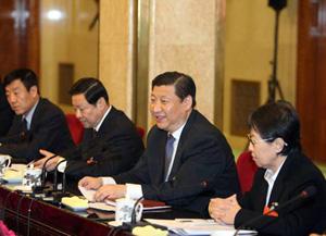 Xi Jinping, who joined the delegation of northern Inner Mongolia Autonomous Region, urged the local government to give prominence to building resource-conserving, environment-friendly society in the process of industrialization and modernization. (Xinhua Photo)