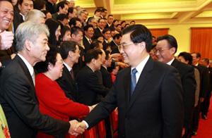 President Hu Jintao (R) and other top leaders greet NPC deputies and CPPCC members from Hong Kong and Macao in the Great Hall of the People in Beijing March 6, 2008. [Xinhua]