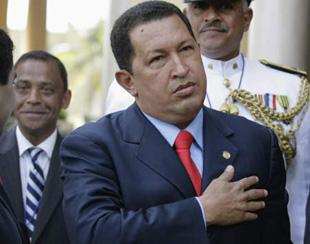 Venezuelan President Hugo Chavez gestures as he arrives for the 20th Group of Rio Summit plenary session at the foreign ministry in Santo Domingo March 7, 2008. (Xinhua/Reuters Photo)