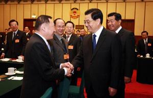 Chinese President Hu Jintao (R front) meets with members of the 11th National Committee of the Chinese People's Political Consultative Conference (CPPCC) from China Zhi Gong Dang (CZGD) and the All-China Federation of Returned Chinese (ACFRC) in Beijing, capital of China, March 7, 2008. (Xinhua/Ju Peng)