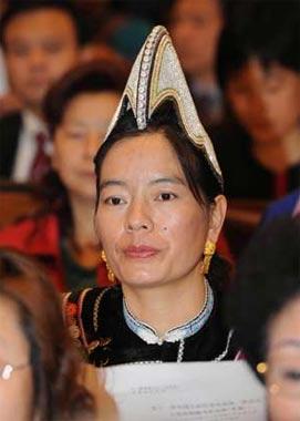 An ethnic deputy to the First Session of the 11th National People's Congress (NPC) listens during a preparatory meeting at the Great Hall of the People in Beijing, capital of China, March 4, 2008. (Xinhua/Gao Jie)