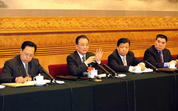 Chinese Premier Wen Jiabao (2nd L) meets with deputies to the First Session of the 11th National People's Congress (NPC) from central China's Henan Province in Beijing, China, March 8, 2008. Wen Jiabao joined in the panel discussion of Henan delegation on Saturday during the First Session of the 11th NPC. (Xinhua Photo)