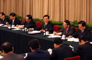 Chinese President Hu Jintao (3rd R) meets with deputies to the First Session of the 11th National People's Congress (NPC) from east China's Shandong Province in Beijing, capital of China, March 9, 2008. Hu Jintao joined in the panel discussion of Shandong delegation on Sunday during the First Session of the 11th NPC.(Xinhua Photo)