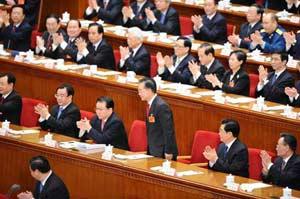 Wen Jiabao (standing) is approved to be premier of China's State Council according to the result of a secret ballot by legislators at the ongoing session of the 11th National People's Congress in Beijing, capital of China, March 16, 2008. (Xinhua/Li Tao)