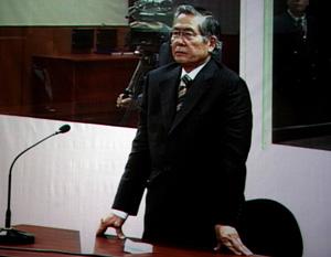 The video grab image taken on Dec. 11, 2007 shows former Peruvian President Alberto Fujimori waiting to be sentenced in Lima, capital of Peru. A Peruvian court sentenced Alberto Fujimori to six years in prison for abuse of power and ordered him to pay a fine of 400,000 new soles (around 132,000 U.S. dollars) to the state. (Xinhua File Photo)