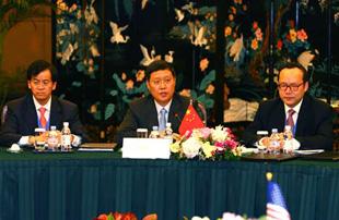 Chinese Assistant Foreign Minister He Yafei(C) speaks at the meeting attended by officials from China, United States, Russia, Britain, France, Germany and the Council of European Union in Shanghai April 16.  (Xinhua Photo)