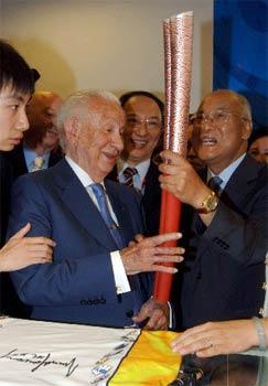 File photo: Former IOC president Samaranch and the 2008 Olympice Torch