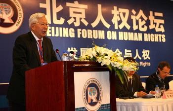 Luo Haocai, the China Society for Human Rights Studies director, speaks at the inaugural Beijing Forum on Human Rights in Beijing on Monday, April 21, 2008. The theme of this forum is "development, security and human rights", and more than 40 experts from 32 national and international organizations are present at the forum. [Photo: Xinhua]
