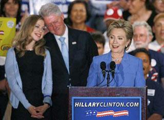 U.S. Democratic presidential candidate Senator Hillary Clinton (D-NY) with her husband, former President Bill Clinton (L) speaks to supporters at her North Carolina and Indiana primary election night rally in Indianapolis, Indiana, May 6, 2008.(Xinhua/Reuters Photo)