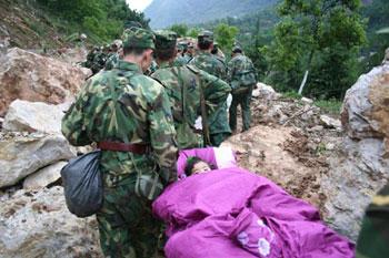 Song Xinyi, a 3-year-old earthquake survivor, is saved in earthquake-hit Beichuan County, southwest China's Sichuan Province, May 14, 2008.  (Xinhua Photo)
