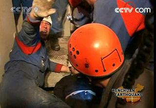 A 61-year-old woman was saved on Saturday evening by Russian rescuers after being buried for up to 127 hours in rubble in the quake-ravaged southwest China's Sichuan Province.