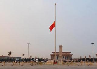 China's national flag flies at half-mast after the flag-raising ceremony on Tian'anmen Square in Beijing Monday morning, May 19, 2008. China on Monday begins a three-day national mourning for the tens of thousands of people killed in a powerful earthquake which struck the country's southwest on May 12. (Xinhua Photo)