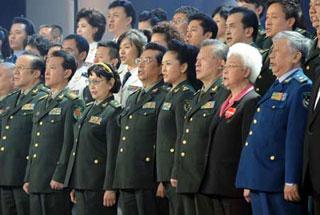 Chinese artists sing a song at a benefit gala held specially for the quake-stricken people of Sichuan Province in Beijing May 18, 2008.(Xinhua Photo)