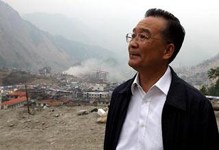 Chinese Premier Wen Jiabao gazes at the quake-devastated Beichuan town, in southwest China's Sichuan Province, on May 22, 2008. Wen Jiabao made his second trip to the quake-battered zone on Thursday afternoon to oversee disaster relief work. (Xinhua/Yao Dawei)