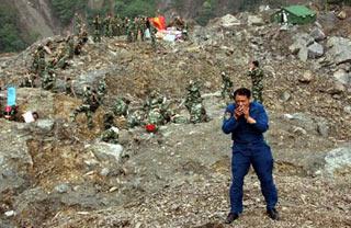 Professionals and materials are airdropped for operations to blow a barrier lake at Tangjiashan, Beichuan County, which was formed by landslides after the May 12 earthquake and now blocks the river Jianhe.(Xinhua Photo)