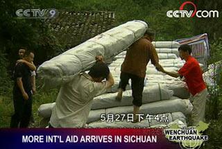 The relief operation continues around the clock as international aid arrives day and night in the quake-stricken areas of Sichuan.