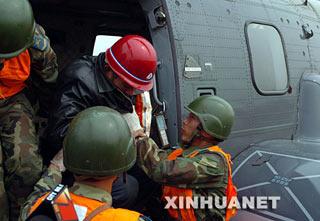 Mi Chengfu, aged 51 is airlifted by helicopter Sunday morning to a hospital in Guanghan City, 25 kilometers north of the provincial capital Chengdu.