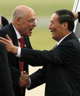Chinese Vice-Premier Wang Qishan (R) is greeted by US Treasury Secretary Henry Paulson at Andrews Air Force Base, Maryland, June 16, 2008.[Photo: Agencies]