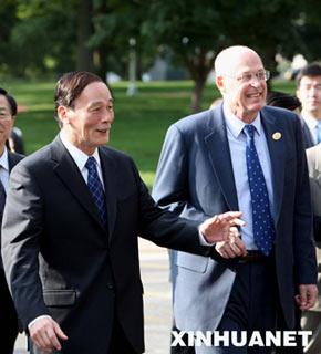 Chinese Vice Premier Wang Qishan (L) and United States Treasury Secretary Henry Paulson walk to the meeting place for the closing session of the 4th round of China-US Strategic Economic Dialogue in Annapolis, Maryland, June 18, 2008. China and the US on Wednesday wrapped up their 4th round of strategic economic dialogue in Annapolis. (Xinhua/Yao Dawei)