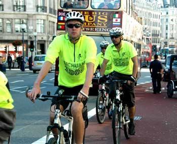 Police from China Town in Birmingham ride bikes toward the Embassy of the People's Republic of China in London, June 30, 2008.(Xinhua Photo)