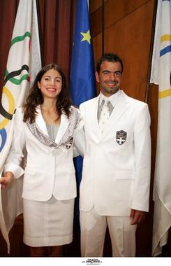 The outfits will be mainly white and the female athletes will wear a matching silk scarf with gray stripes.