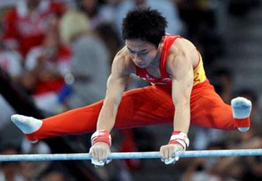 China's Zou Kai competes during men's horizontal bar final of Beijing 2008 Olympic Games at National Indoor Stadium in Beijing, China, Aug. 19, 2008. Zou Kai claimed the title of the event with a score of 16.200. (Xinhua Photo)