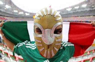 A Mexico supporter wearing a mask attends the fifth day of the athletics competitions during the 2008 Beijing Olympics at the 