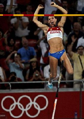 Russia's Yelena Isinbayeva celebrates as she clears the bar to set a new world record during the women's pole vault final at the National Stadium as part of the 2008 Beijing Olympic Games on August 18, 2008.