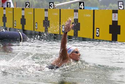 Larisa Ilchenko of Russia gears up to the finish line during women's marathon 10km competition at the Beijing 2008 Olympic Games swimming event in Beijing, China, Aug. 20, 2008. Larisa Ilchenko of Russia won the gold medal of the event.(Xinhua)