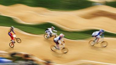 Riders compete in the men's BMX quarterfinals of the 2008 Beijing Olympic Games at the Laoshan BMX Venue, in Beijing on August 20, 2008.