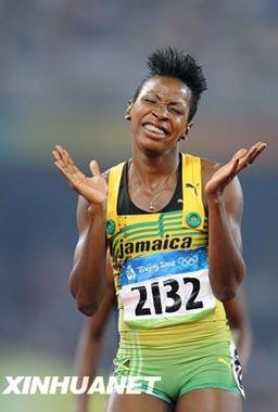 Melaine Walker of Jamaica celebrates after the women's 400m hurdles final at the National Stadium, also known as the Bird's Nest, during Beijing 2008 Olympic Games in Beijing, China, Aug. 20, 2008. Melaine Walker won the title with 52.64 seconds and set a new Olympic record.(Xinhua/Guo Dayue)
