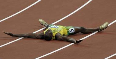 Usain Bolt of Jamaica celebrates after winning the men's 200m final of the athletics competition in the National Stadium at the Beijing 2008 Olympic Games August 20, 2008. Bolt set a new world record with a timing of 19.30 seconds. [Agencies]