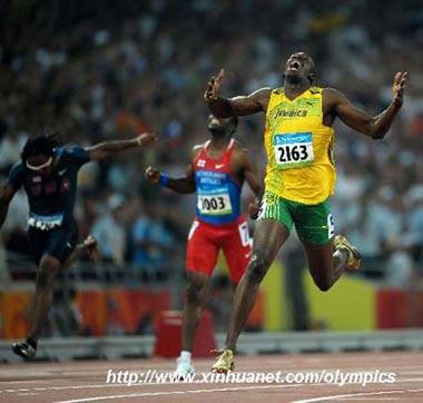 Usain Bolt (R) of Jamaica jubilates after the men's 200m final at the National Stadium, also known as the Bird's Nest, during Beijing 2008 Olympic Games in Beijing, China, Aug. 20, 2008. Usain Bolt of Jamaica won the title with 19.30 seconds and set a new world record. (Xinhua/Liu Dawei)