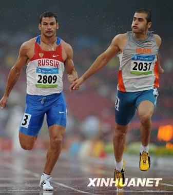 Athlete of Iran(right) and athlete of Russia are crossing the finishing line in the men's decathlon 100m at the Beijing Olympic Games, Aug.21. (Xinhua)