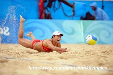 Tian Jia of China saves the ball during the women's gold medal match against Kerri Walsh and Misty May-Treanor of US at the Beijing 2008 Olympic Games beach volleyball event in Beijing, China, Aug. 21, 2008. Wang Jie and Tian Jia got the silver medal in the event. (Xinhua/Sadat)