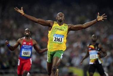 Usain Bolt of Jamaica celebrates winning the men's 200m final of the athletics competition in the National Stadium at the Beijing 2008 Olympic Games August 20, 2008.