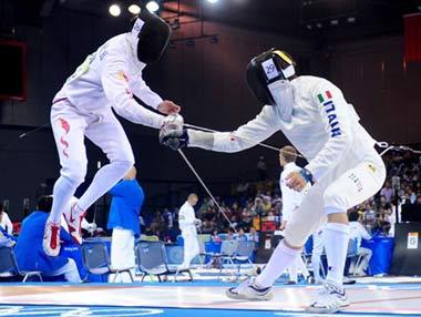 Qian Zhenhua (L) of China competes with Andrea Valentini of Italy.