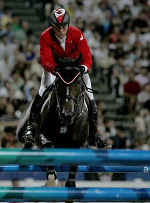 Canadian rider Eric Lamaze jumps his horse Hickstead over an obstacle during the individual jumping final of the Beijing 2008 Olympic Games equestrian events in Hong Kong, China, Aug. 21, 2008. (Xinhua)