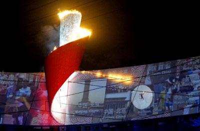 The torch of the 2008 Beijing Olympic Games is lit at the National stadium in Beijing during the opening ceremony of the Games on August 8, 2008.