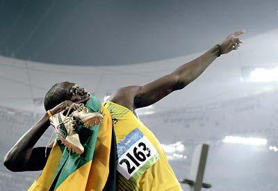 Jamaica's Usain Bolt celebrates winning the men's 200m final at the 