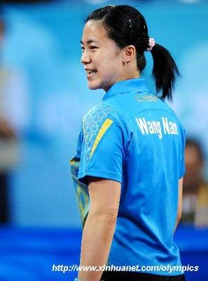 Wang Nan of China reacts while competing with Guo Yue of China during the women's singles semifinal at Beijing Olympic Games table tennis event in Beijing, China, Aug. 22, 2008. Wang Nan won the match 4-2. (Xinhua)