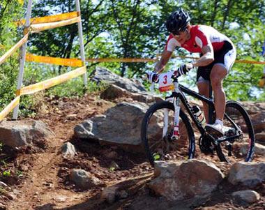 Sabine Spitz of Germany competes during the women's cross country of the Beijing Olymic Games cycling-mountain bike event at Laoshan Mountain Bike Course in Beijing, China, Aug. 23, 2008. Sabine Spitz of Germany claimed the title in this event with a time of 1:45.11.(Xinhua Photo/Zhang Duo)