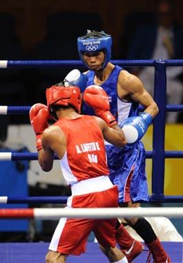 Somjit Jongjohor(blue) of Thailand competes during Men's Fly (51kg) Final Bout between Andris Laffita Hernandez of Cuba and Somjit Jongjohor of Thailand of Beijing 2008 Olympic Games boxing event at Workers' Gymnasium in Beijing, China, Aug. 23, 2008. Somjit Jongjohor defeated Andris Laffita Hernandez, and won the gold medal of the event.(Xinhua Photo)