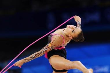 Evgeniya Kanaeva of Russia competes during the individual all-round final at the Beijing 2008 Olympic Games rhythmic gymnastics event in Beijing, China, Aug. 23, 2008. Evgeniya Kanaeva won the gold medal of the event. (Xinhua/Cheng Min)