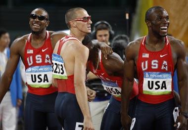 Runners of the United States react after the men's 4x400m relay final at the National Stadium, also known as the Bird's Nest, during Beijing 2008 Olympic Games in Beijing, China, Aug. 23, 2008. The team of the United States won the title with 2:55.39 and set a new Olympic record. (Xinhua/Liao Yujie)