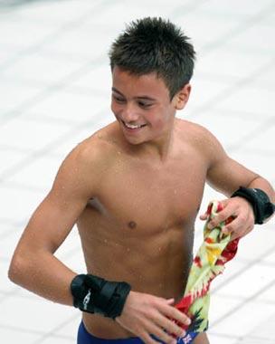 Thomas Daley of Great Britain smiles during Men's 10m Platform Semifinal of Beijing 2008 Olympic Games diving event in Beijing, China, Aug. 23, 2008. Thomas Daley ranked 8th with a total score of 458.60 in the semifinal and was qualified for the final. The 14-year-old boy, who won the bronze in the men's synchronized 10m platform of the FINA Diving World Cup earlier this year, and grabbed the gold in the men's 10m platform of European Swimming Championships in this March, has realized his dream to compete in the Olympic Games with the world's best divers this August. His unusual performance, counterpointing his young age, has captured the media's attention and was dubbed as "diving prodigy". (Xinhua/Liu Yu)