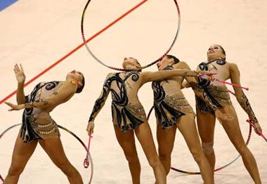The team of Russia compete in the 3 hoops and 2 clubs contest of the group all-around final of Beijing Olympic Games gymnastics rhythmic event in Beijing, China, Aug. 24, 2008. Russia won the gold medal in the group all-around final. (Xinhua Photo)