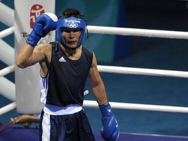 Bakhyt Sarsekbayev of Kazakhstan reacts during men's welter (69kg) final bout at the Beijing 2008 Olympic Games boxing event in Beijing, China, Aug. 24, 2008. Bakhyt Sarsekbayev won the match over Carlos Banteaux Suarez of Cuba and got the gold medal in the event.(Xinhua Photo)